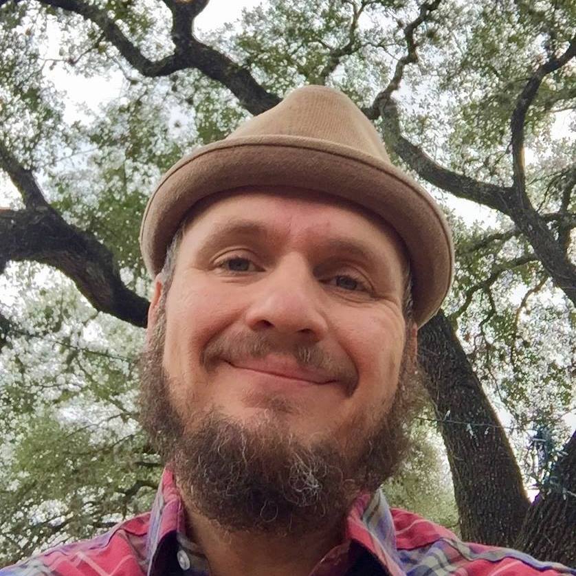 Gray selfie beneath tree